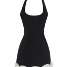 Black CAKE BOW mini dress by Stolen Stores, showing a fitted sleeveless design with a stylish bow detail at the waist.