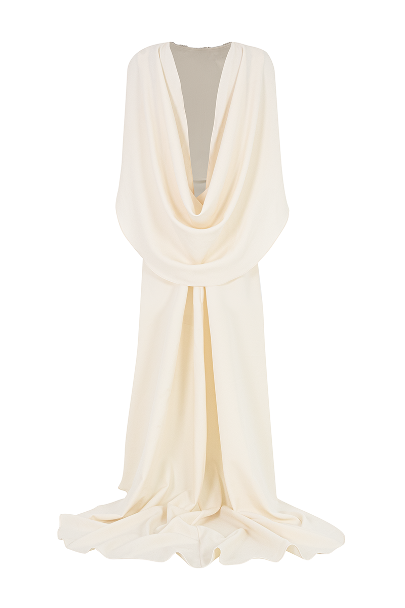 Elegant Valenciani gown with a cowl back and cape sleeves, featuring flowing fabric and sophisticated design.