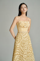 Beige CULT MIA X HAPPY CLOTHING flower wave A-line gown with floral details and flowing silhouette, perfect for elegant occasions.