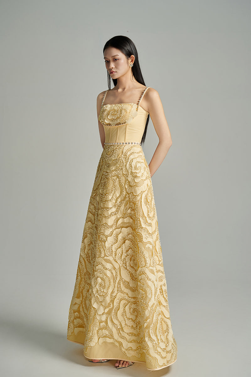Beige CULT MIA X HAPPY CLOTHING flower wave A-line gown with floral pattern and flowing silhouette, perfect for elegant occasions.