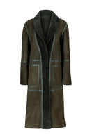 Verheyen ZINA Biker Green Shearling Coat displayed on a hanger, showcasing its stylish design and vibrant green color.