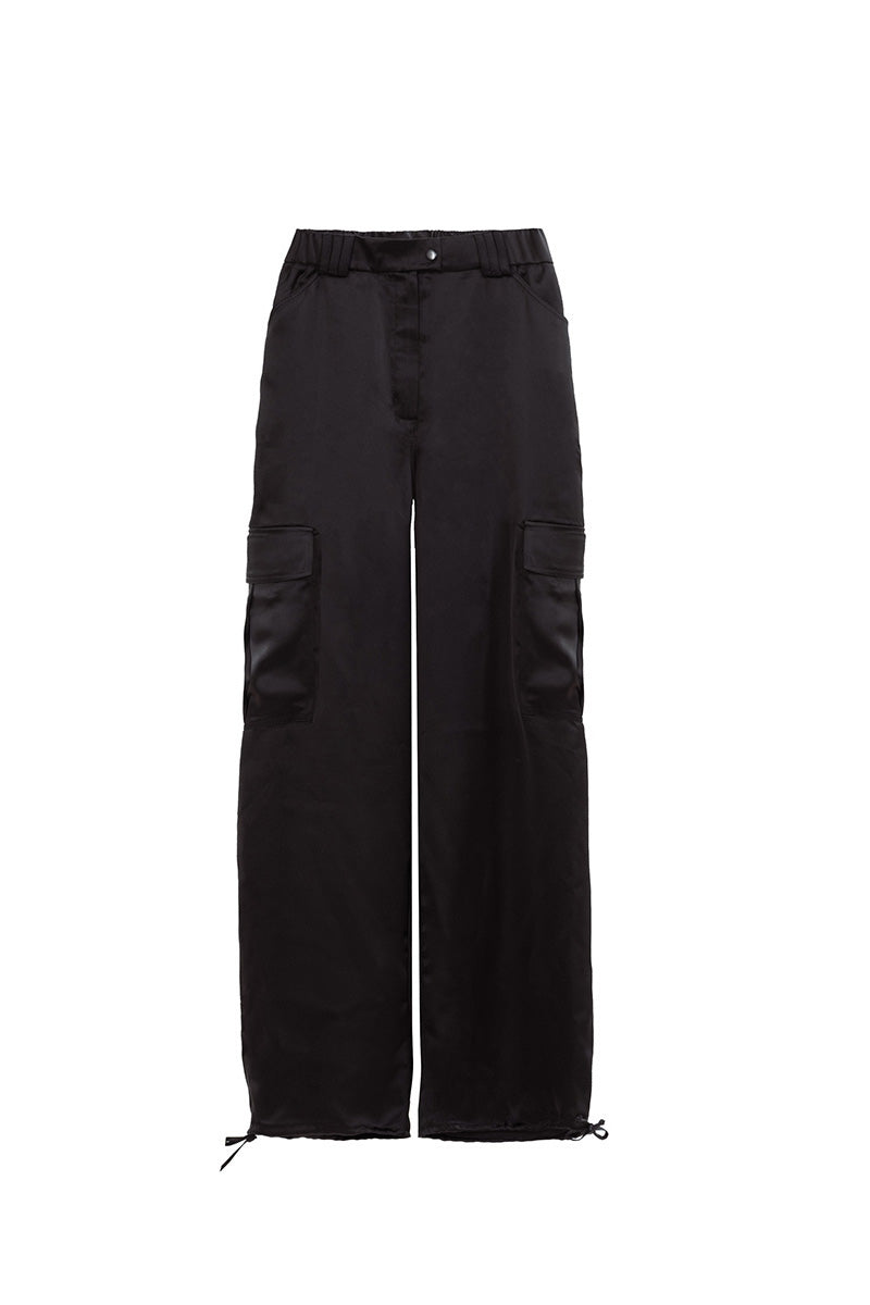 Black Kris Marán silky cargo pants with soldier-style pockets, featuring a relaxed fit and modern streetwear design.