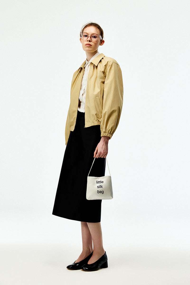 Beige cotton bomber jacket by Chictopia featuring a classic fit, ribbed cuffs, and front zipper closure in a stylish casual look.