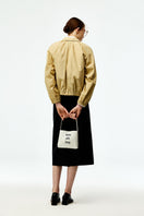 Black silk wool midi skirt by Chictopia, shown with a smooth, flowing fabric and a classic midi length.