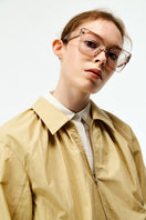 Beige cotton bomber jacket from Chictopia featuring a classic fit and ribbed collar, shown on a model.