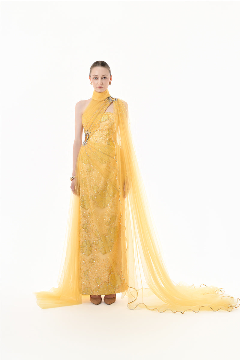 Golden yellow embellished tulle cape gown from Happy Clothing, featuring intricate detailing and flowing fabric.