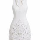 Keira Tong Flora embroidered mini dress with floral pattern and delicate embroidery, perfect for casual or summer wear.