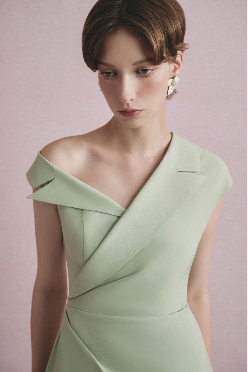 White Plan Arden asymmetric midi dress with a flowy silhouette and elegant design, showcased on a model.