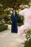 Navy love blazer by Estefania featuring tailored fit and classic lapel, displayed on a hanger against a neutral background.