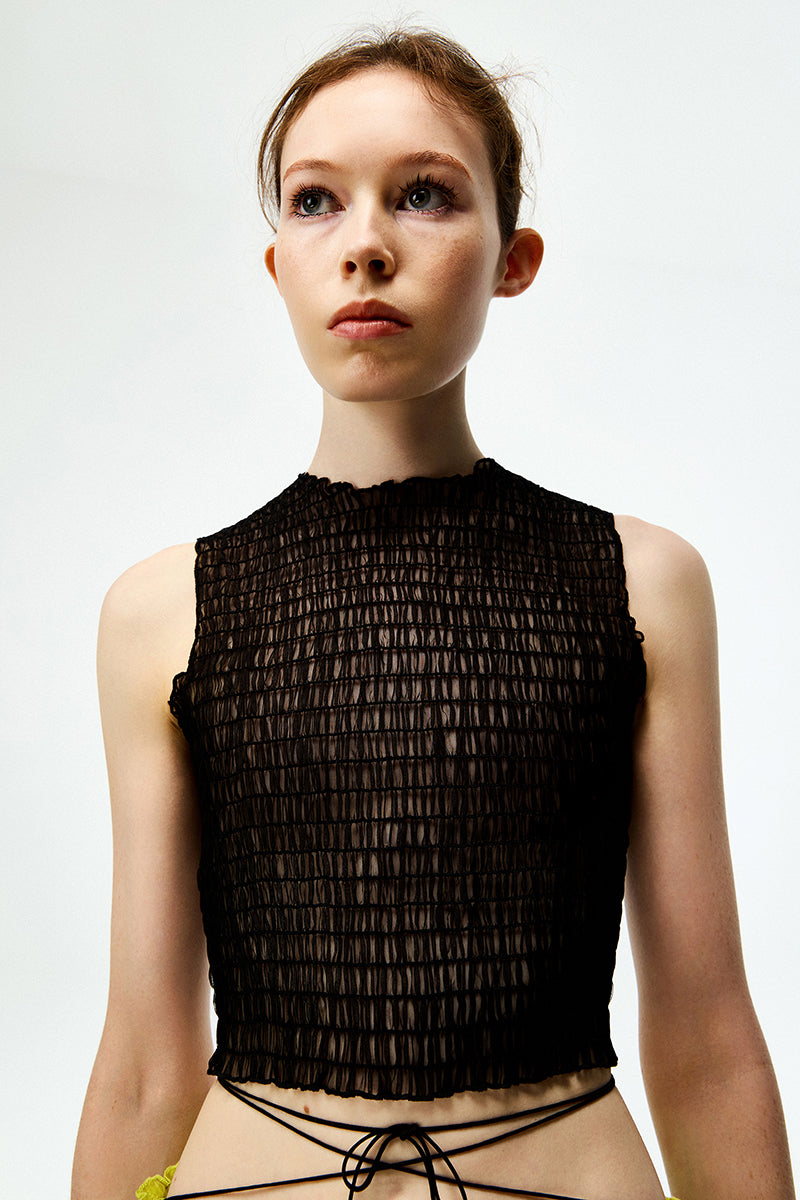 Black organza tank top by Chictopia, lightweight and sheer, shown on a model with delicate straps and stylish fit.