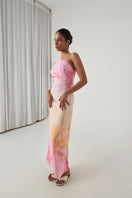 Summer Away Ronda Maxi Dress in Afterglow, flowing fabric with a vibrant sunset-inspired color, styled with thin shoulder straps.