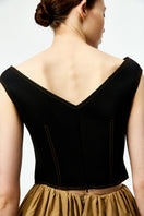 Black Chictopia bustier top with lace detailing and adjustable straps, styled for a fashionable, fitted look.