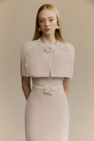 White Plan Mara pink midi dress displayed on a hanger with flowing fabric and elegant design.