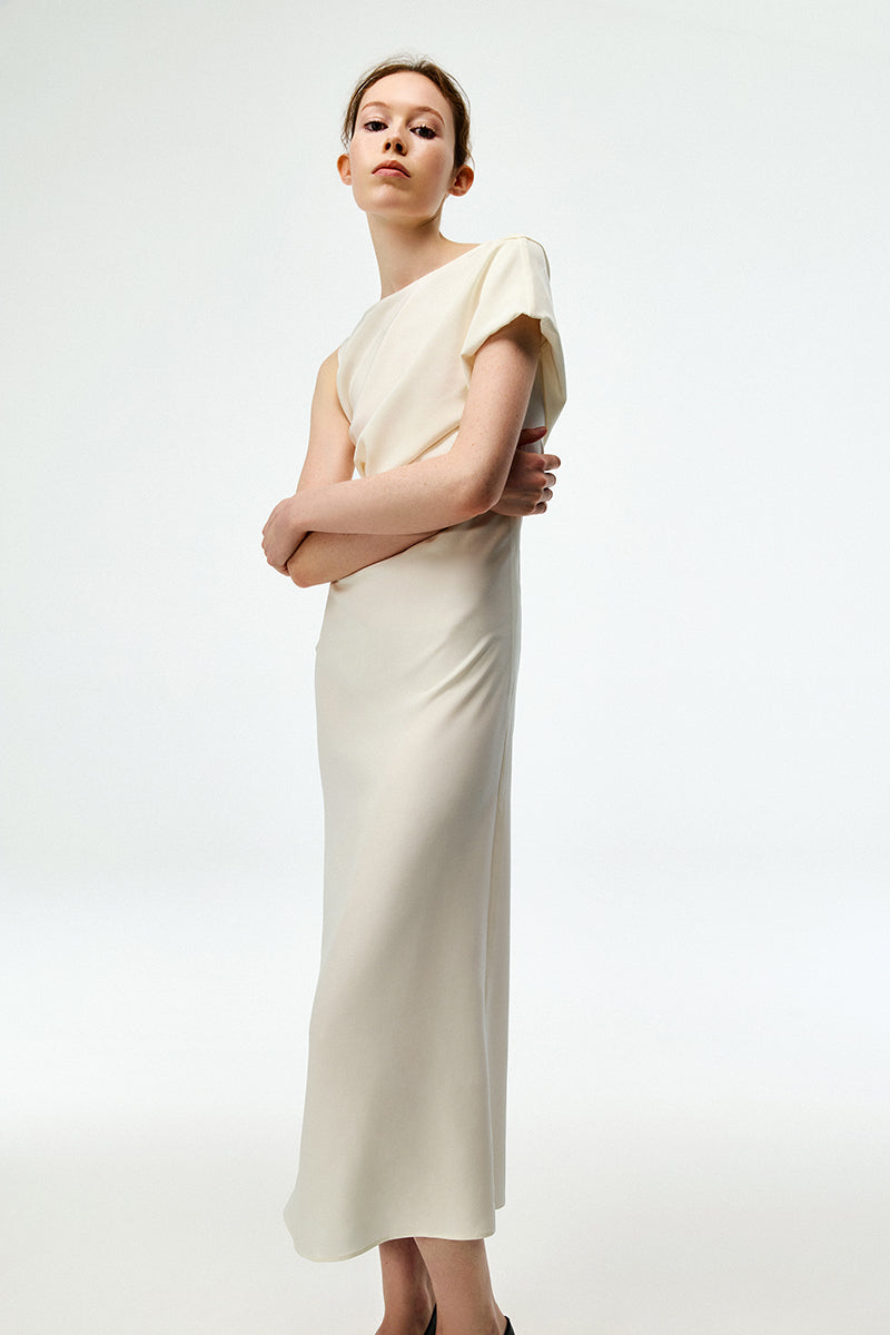 Chictopia ivory crepe maxi dress displayed on a hanger with flowing fabric and elegant design, perfect for formal occasions