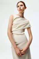 Elegant ivory crepe maxi dress by Chictopia, featuring a flowing design and subtle details perfect for sophisticated occasions.