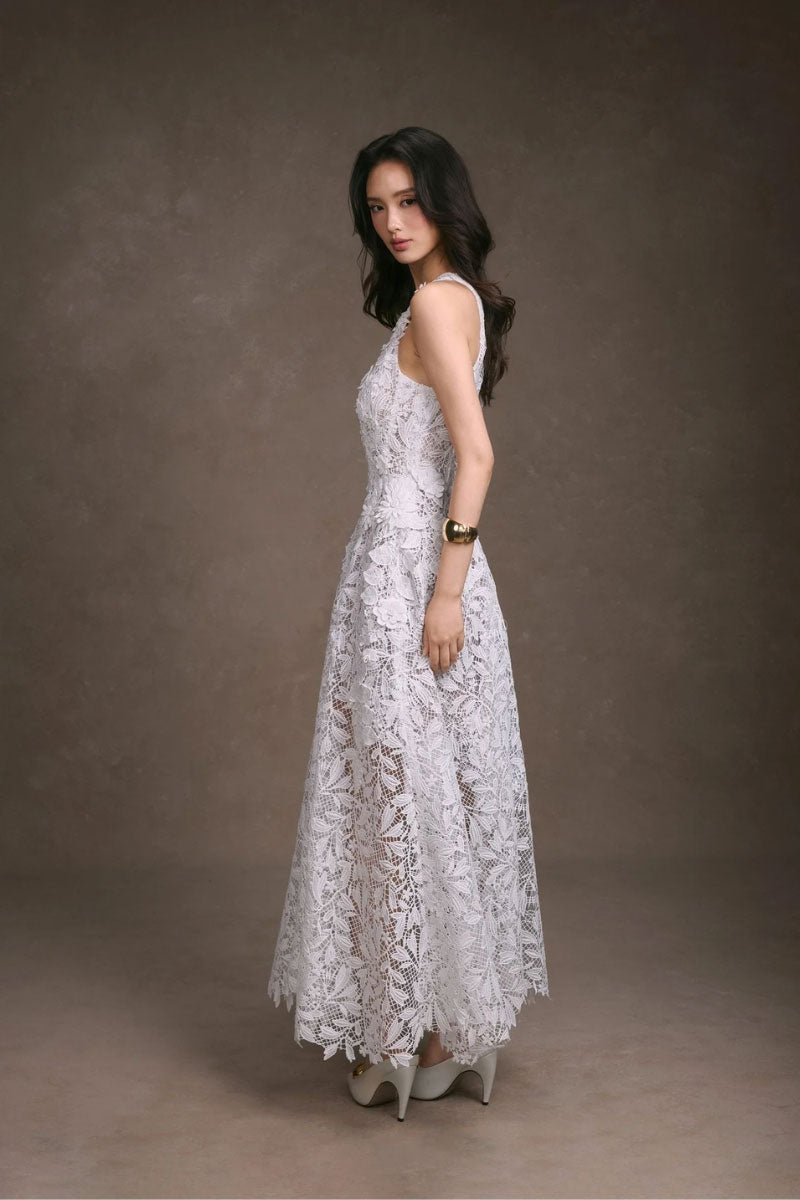 Elegant floral lace maxi dress by KEIRA TONG featuring intricate lace details and a flowing silhouette.