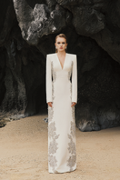 Elegant V-neck symmetric gown by Tracy Studio featuring crystal embellishments and a stylish side design.