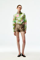 Chictopia taffeta shorts in oyster color, stylish and lightweight, shown on a model with a relaxed fit and elegant texture.