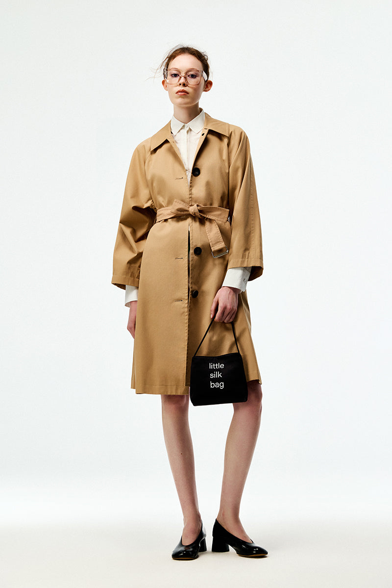 Beige cotton trench coat from Chictopia, stylish and lightweight outerwear with classic design and button details.