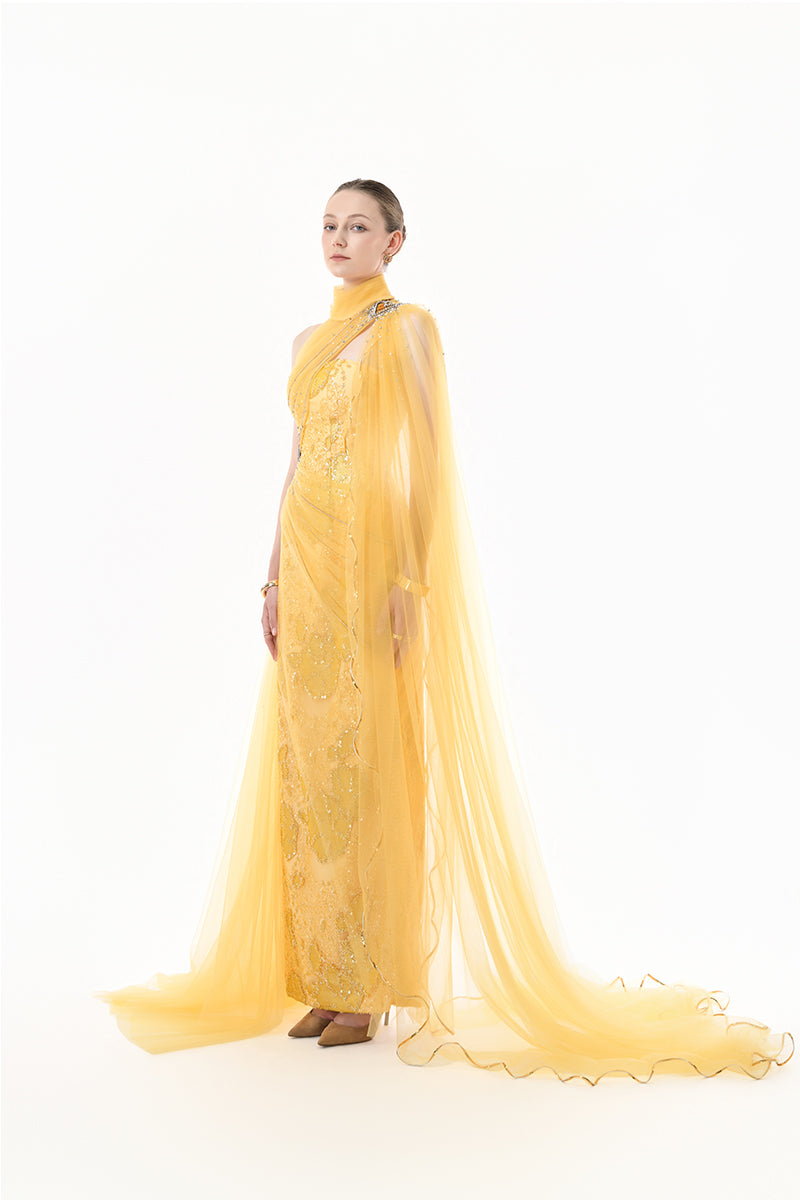 Golden yellow embellished tulle cape gown by Happy Clothing, featuring intricate beadwork and flowing tulle fabric.