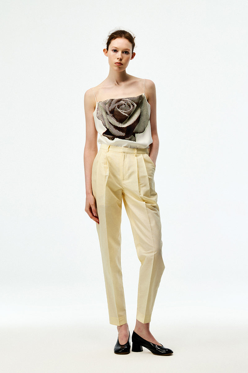 Beige cotton linen pants by Chictopia, featuring a relaxed fit and natural fabric texture, perfect for casual wear.