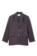 Relaxed single-breasted blazer by Dāl the Label, shown in a tailored fit with lapels and front pockets on a neutral background.