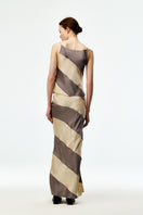 Gray and cream silk satin maxi skirt from Chictopia, flowing fabric with a smooth, elegant drape.