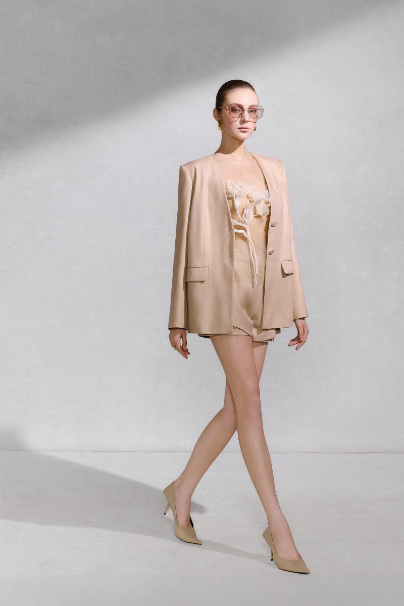 Arti Apparel Tellus Top, stylish women's blouse with a relaxed fit and soft fabric, displayed on a hanger.