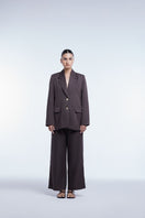 Relaxed single-breasted blazer by Dāl the Label featuring a tailored fit and classic lapel, shown in a neutral color.