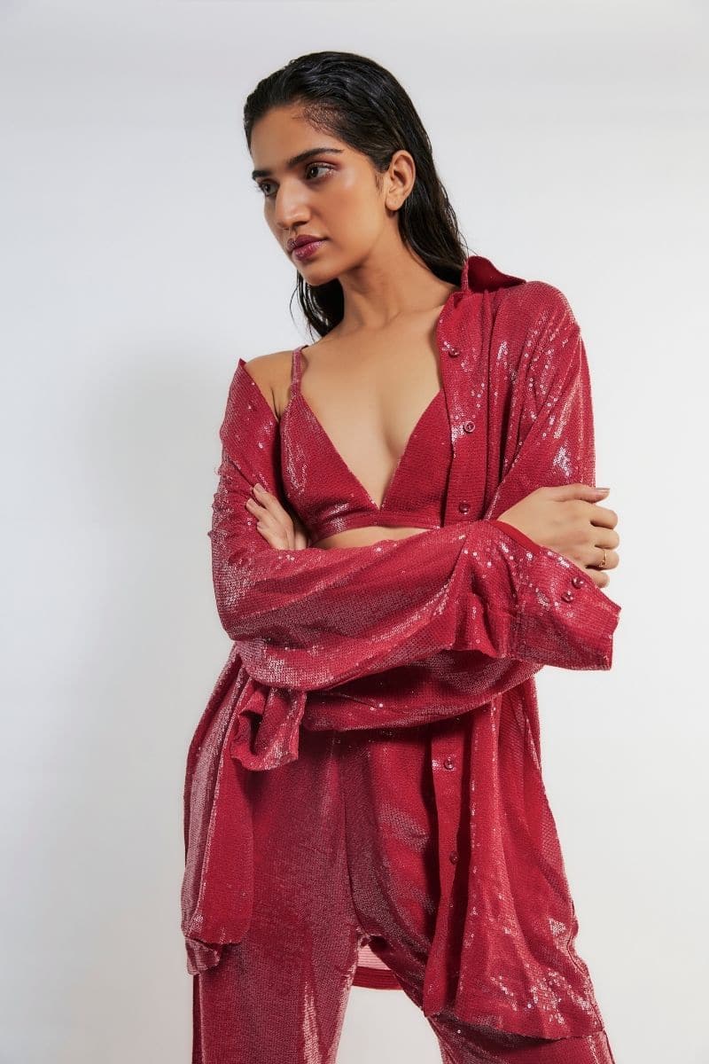Deme By Gabriella Tracy red sequin co-ord set featuring a fitted top and matching high-waisted pants with sparkling sequin details.