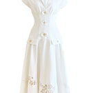 White sleeveless shirt and orchid-flowered midi dress by Do Long, displayed on a mannequin, showcasing casual and elegant summer fashion.