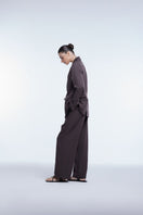Relaxed single-breasted blazer by Dāl the Label, shown in a tailored fit with lapel collar and stylish structured design.
