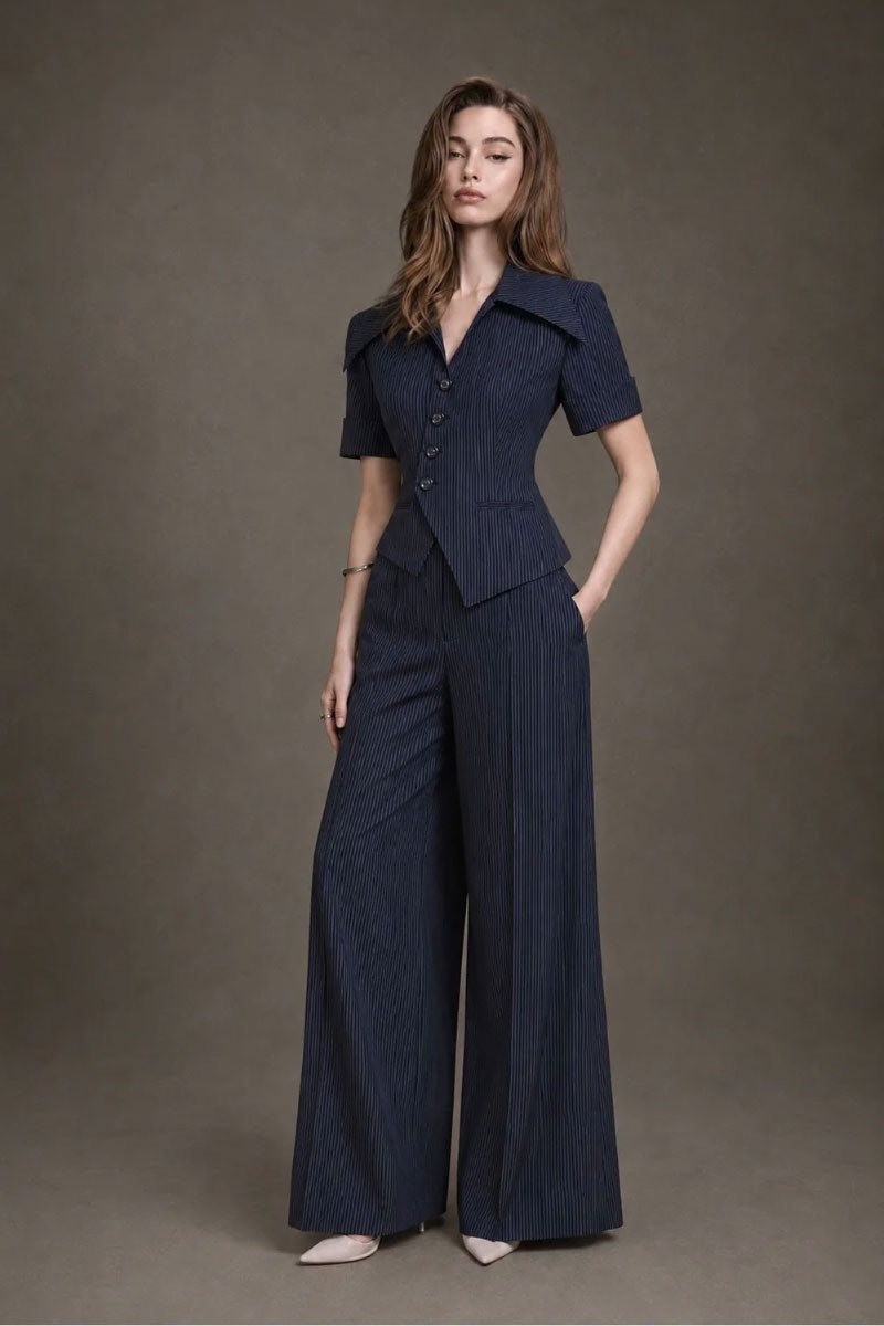 Keira Tong stripe wide-leg pants in black and white, showing the flowy, high-waisted design and relaxed fit.