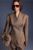 Keira Tong folded blazer, stylish tailored blazer with lapels, in a neutral color, neatly folded for display.