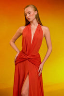 CEM draped chiffon gown with flowing fabric and elegant design, showcased on a mannequin.