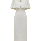 White Plan ivory pearl cape midi dress featuring elegant pearl embellishments and flowing fabric, perfect for formal occasions.