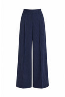 Keira Tong stripe wide-leg pants in black and white with a high waist and relaxed fit, shown on a model.