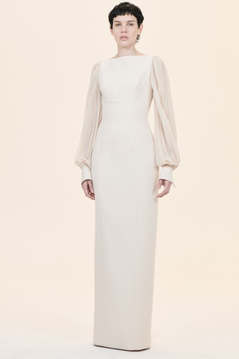 Nihan Peker NAVİGLİ gown featuring elegant fabric and intricate design, displayed on a hanger with detailed close-up of the material.
