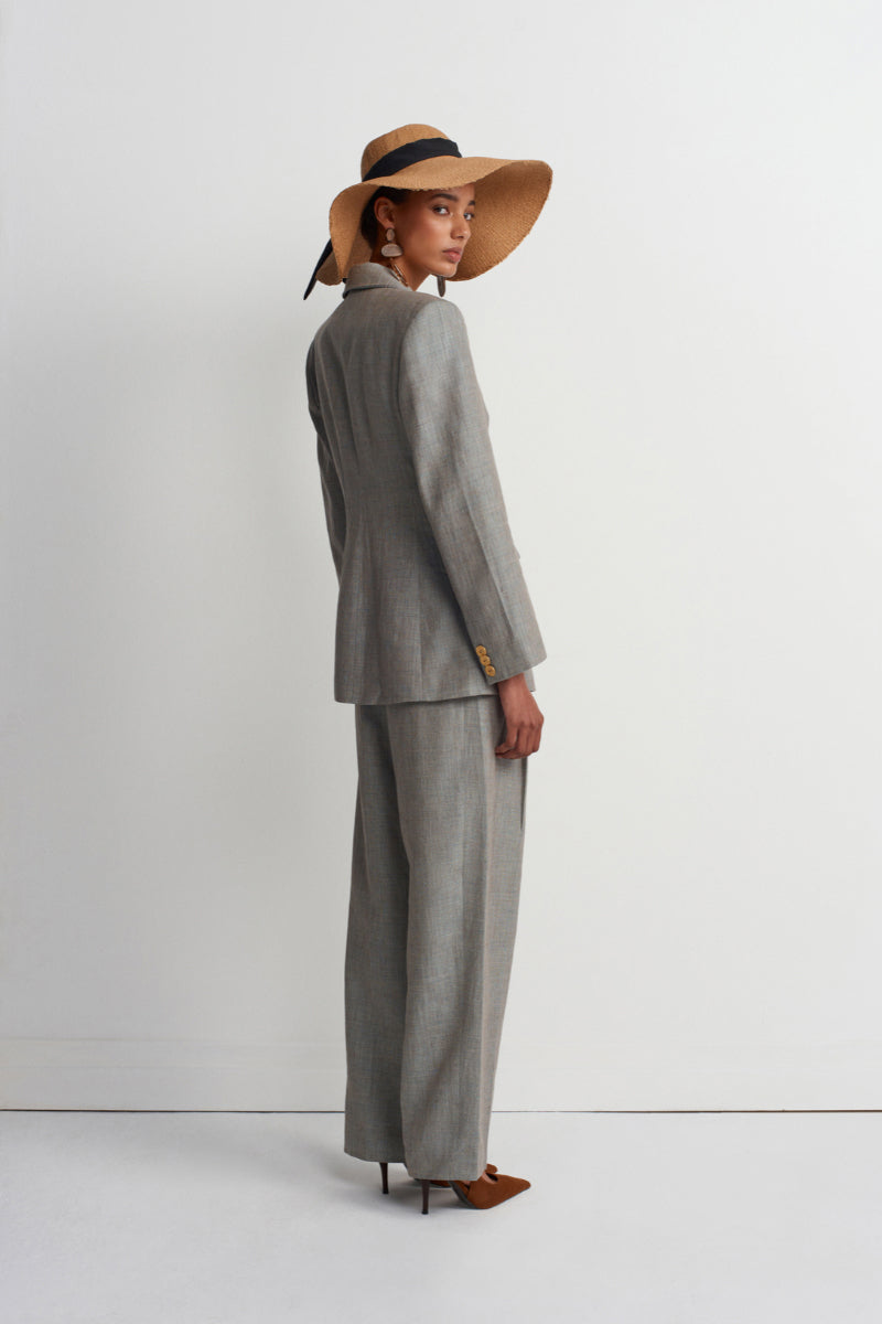 Green melange linen blazer by Acaria Studio, stylish jacket with tailored fit, shown on model with front view.