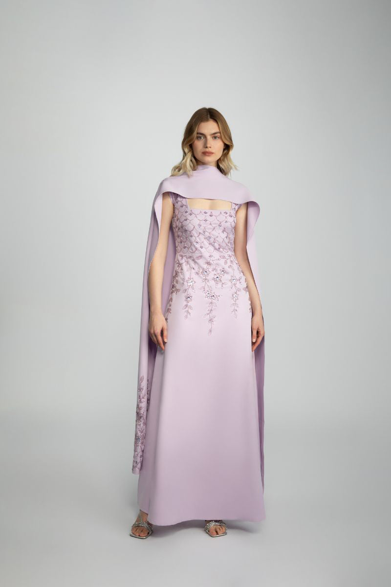 Raishma Lacey gown featuring intricate lace detailing and elegant design, displayed on a model.