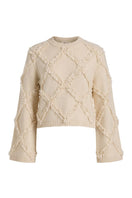 Rebecca Taylor Thea fringe sweater in alabaster, featuring a cozy knit with fringe details and long sleeves.