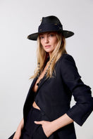 Black fedora hat from LE SH KA featuring shells and 24k gold-plated accessories, stylish and elegant headwear for women.
