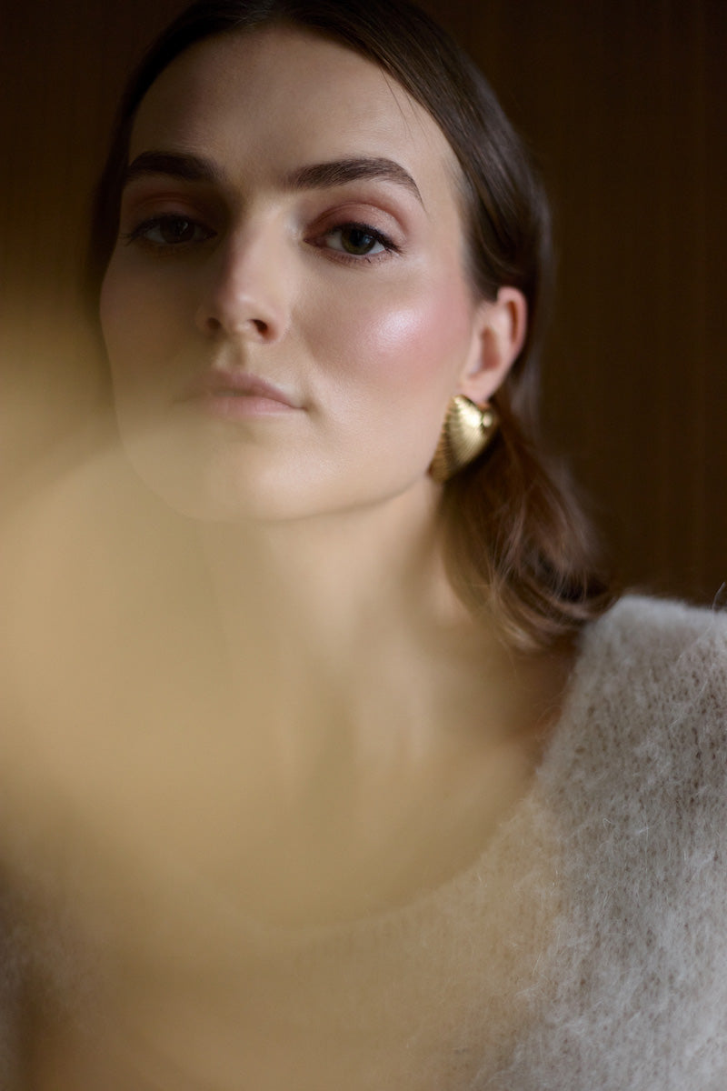 Undress Alexa Cream Mini Sweater Dress, short-sleeve knit dress with a fitted silhouette, displayed on a hanger.