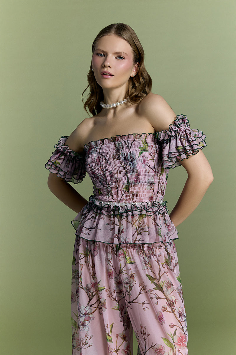Nur Karaata Tropic Allure co-ord set featuring a matching top and pants with vibrant tropical print.