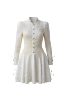 Rosee de Matin The Porcelain Mini dress in white, featuring a fitted silhouette and delicate fabric, displayed on a hanger.