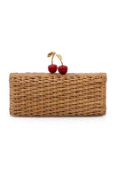Hand-woven cherry rattan clutch bag by Waiwai Rio, showcasing intricate craftsmanship and natural woven texture.