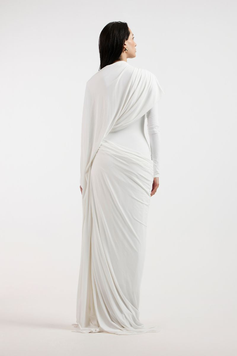 Elegant white draped gown by Deme By Gabriella, featuring flowing fabric and sophisticated design for formal occasions.