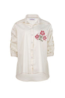 Estefania honey rose blouse with long sleeves and button front, showcasing soft fabric and stylish design.