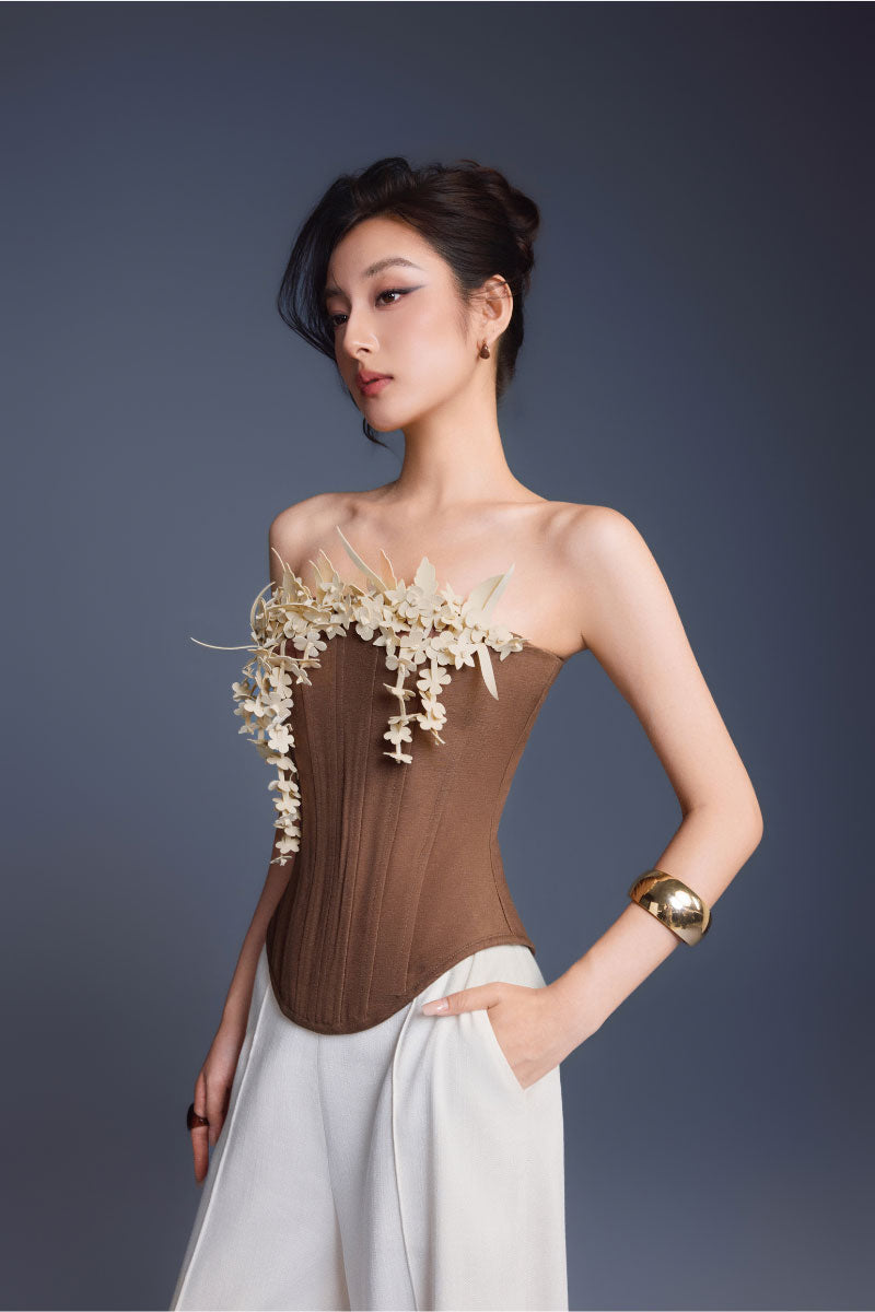 Keira Tong brown bouquet corset top with structured design, featuring floral print and adjustable straps, styled for a fashionable look.