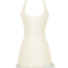 Light yellow Cake Bow mini dress by Stolen Stores, featuring a fitted silhouette and stylish design, shown on a model.